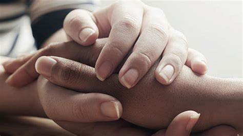 Hands clasping together